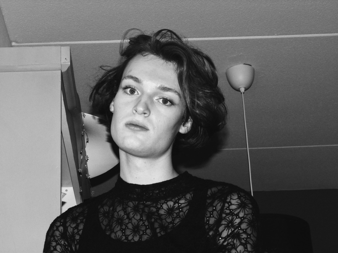 Black and white portrait of me directly looking at the camera.