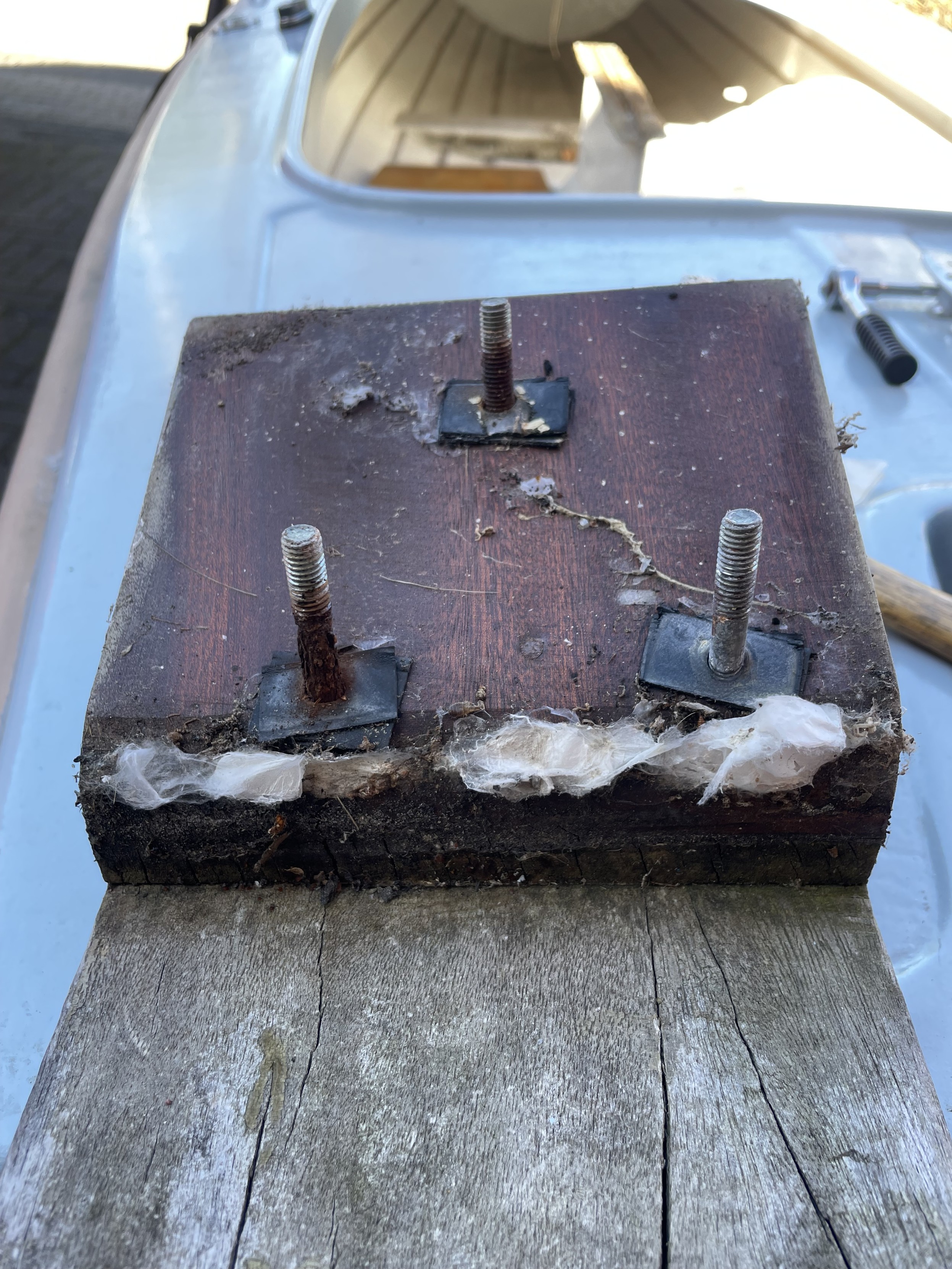block for attaching a motor, taken off, some of the bolts have started to rust