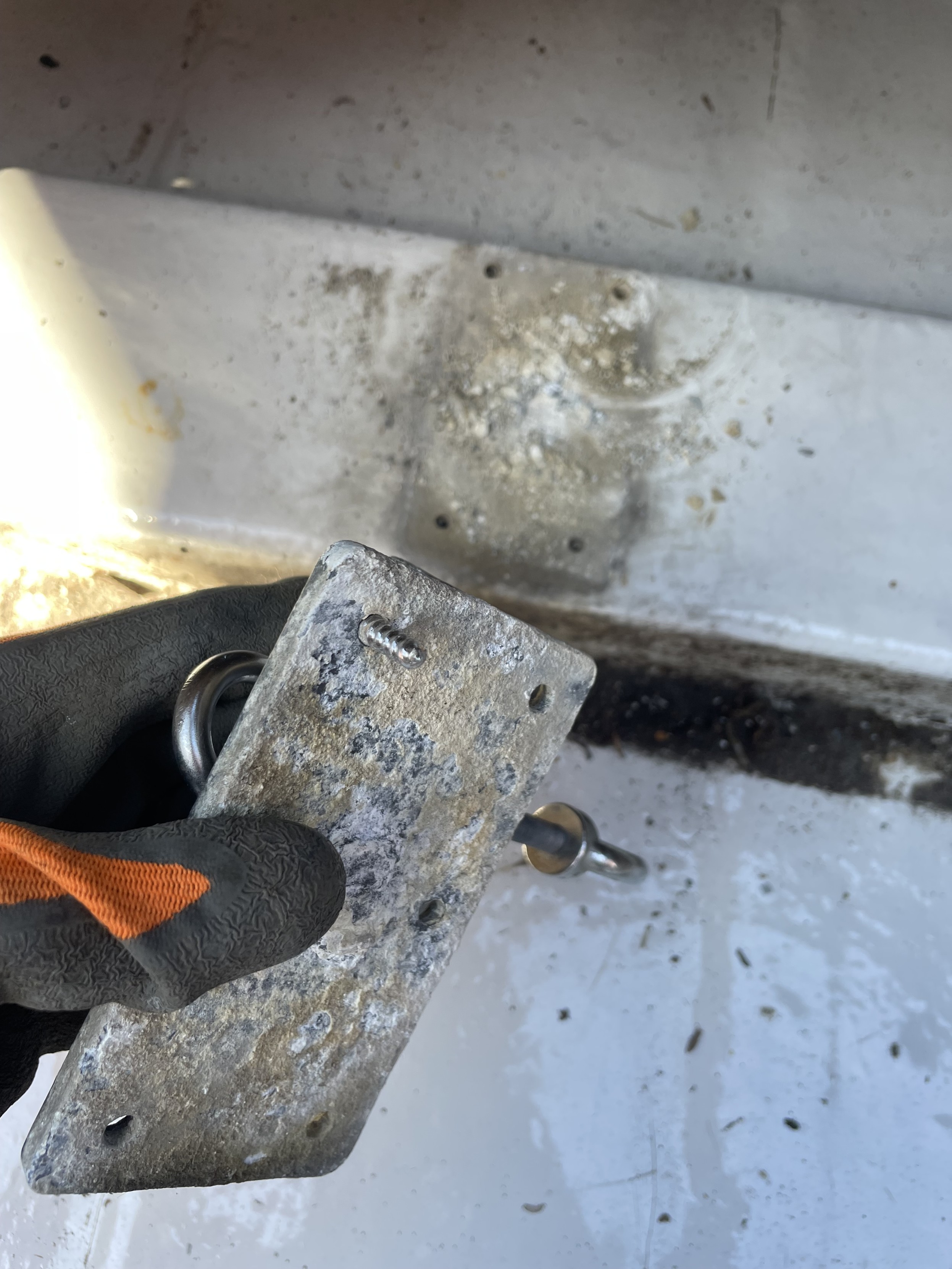 Holding the corroded aluminium plate in my hand.