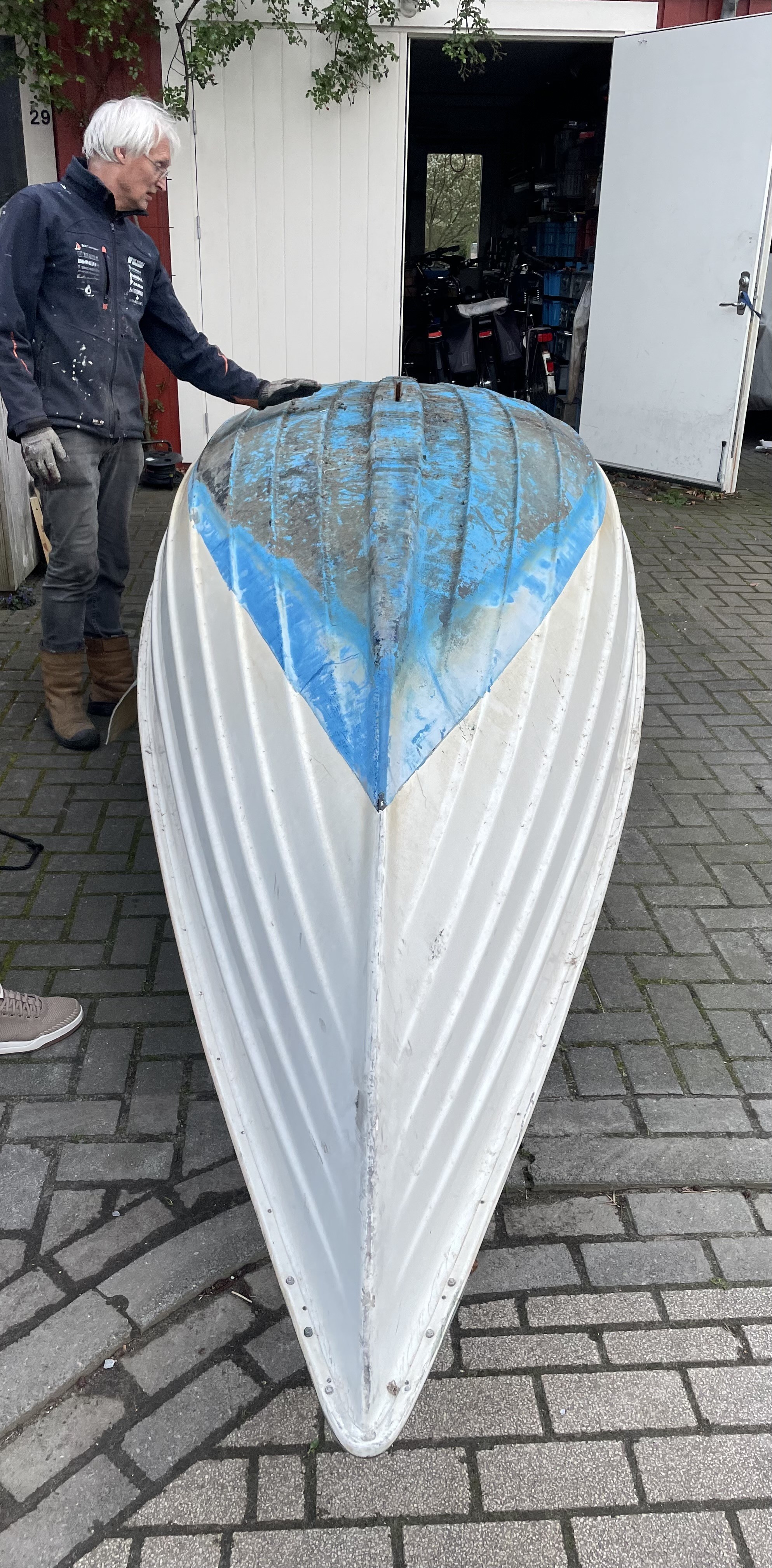 The boat turned upside down, you can see the blue paint on the submerged part of the boat.