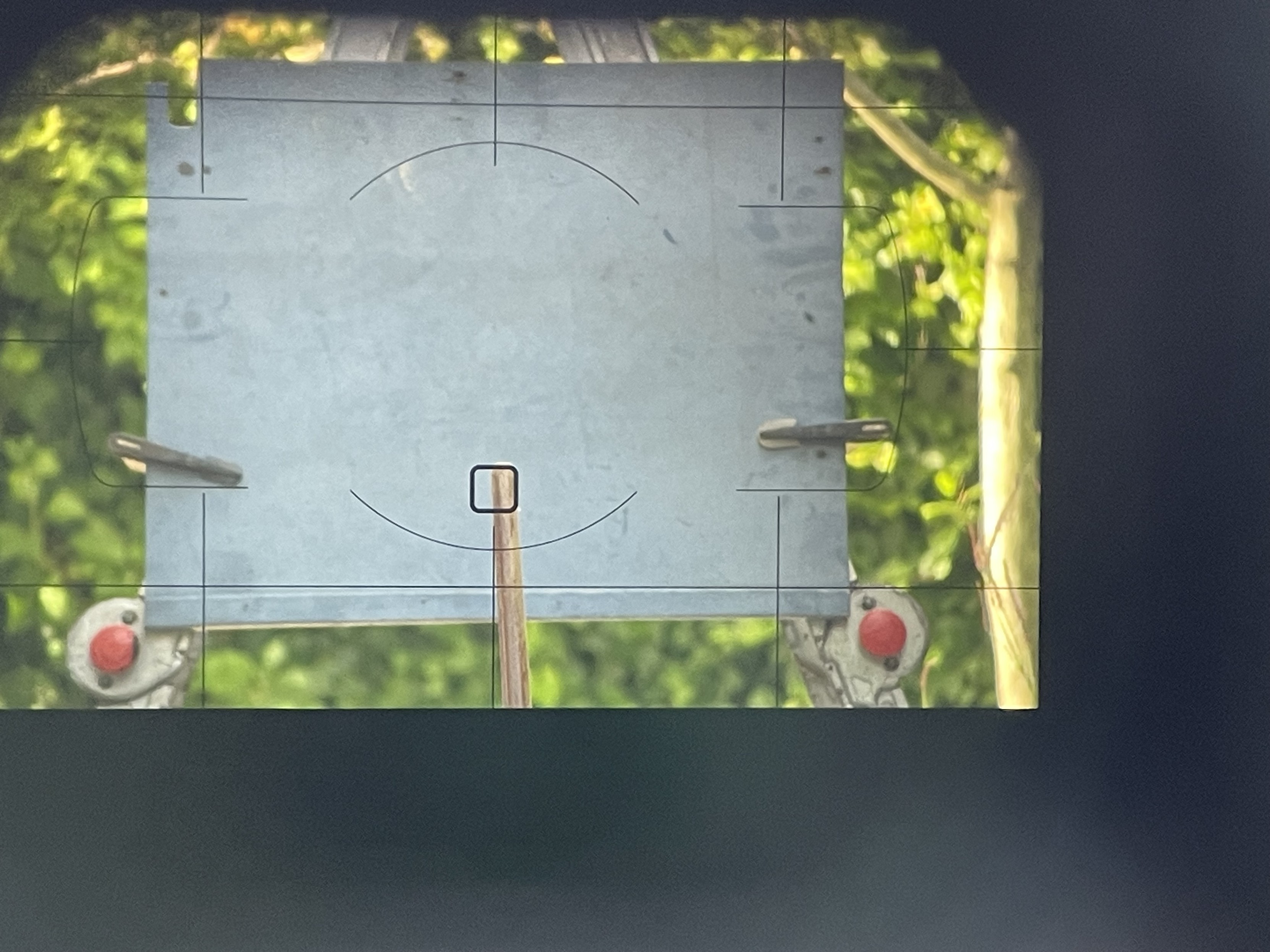 The stick with a focus spot on it through the dslr view finder. 