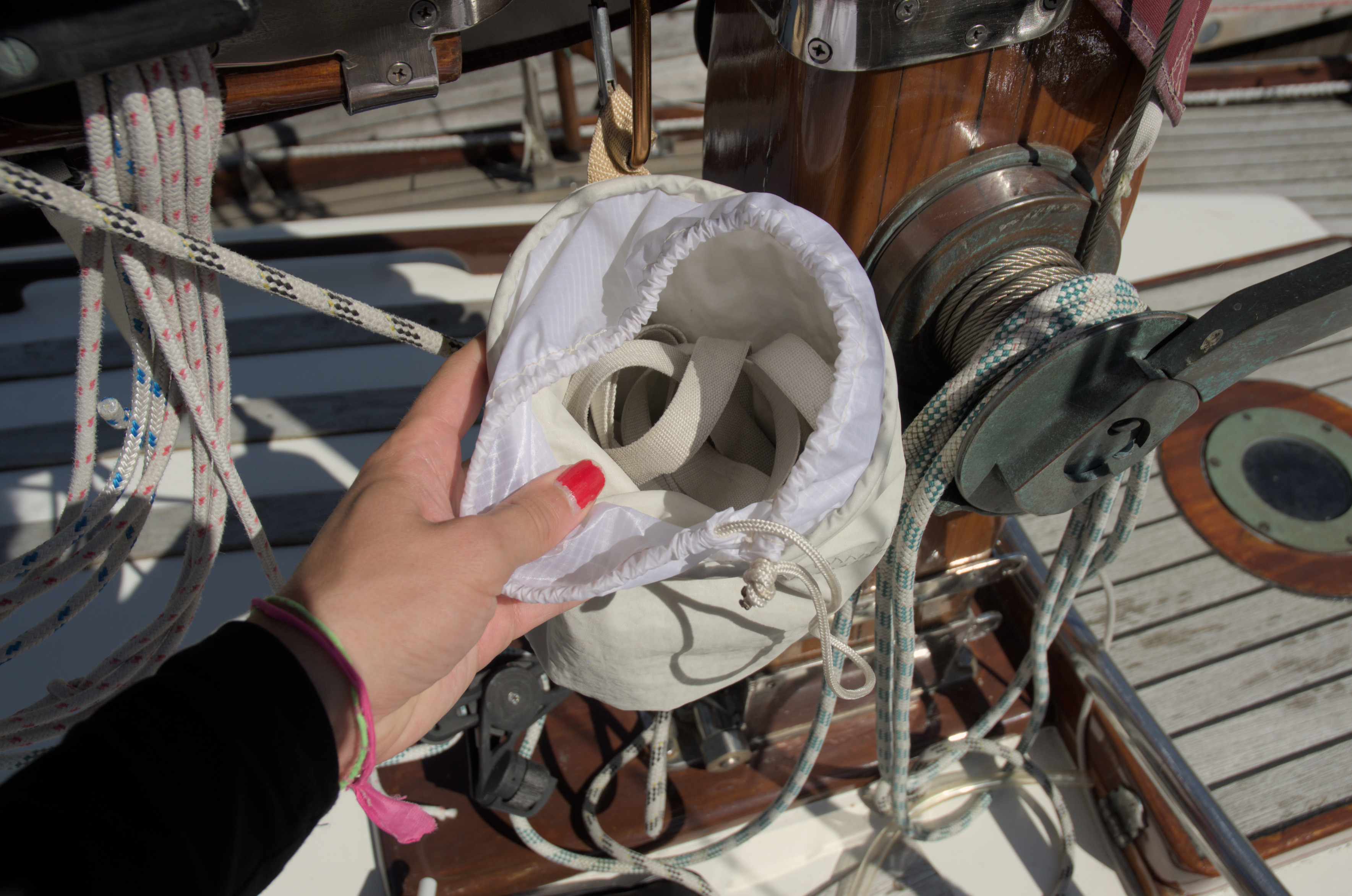 My hand holding open the pouch, you can see the ribbons in the pouch.