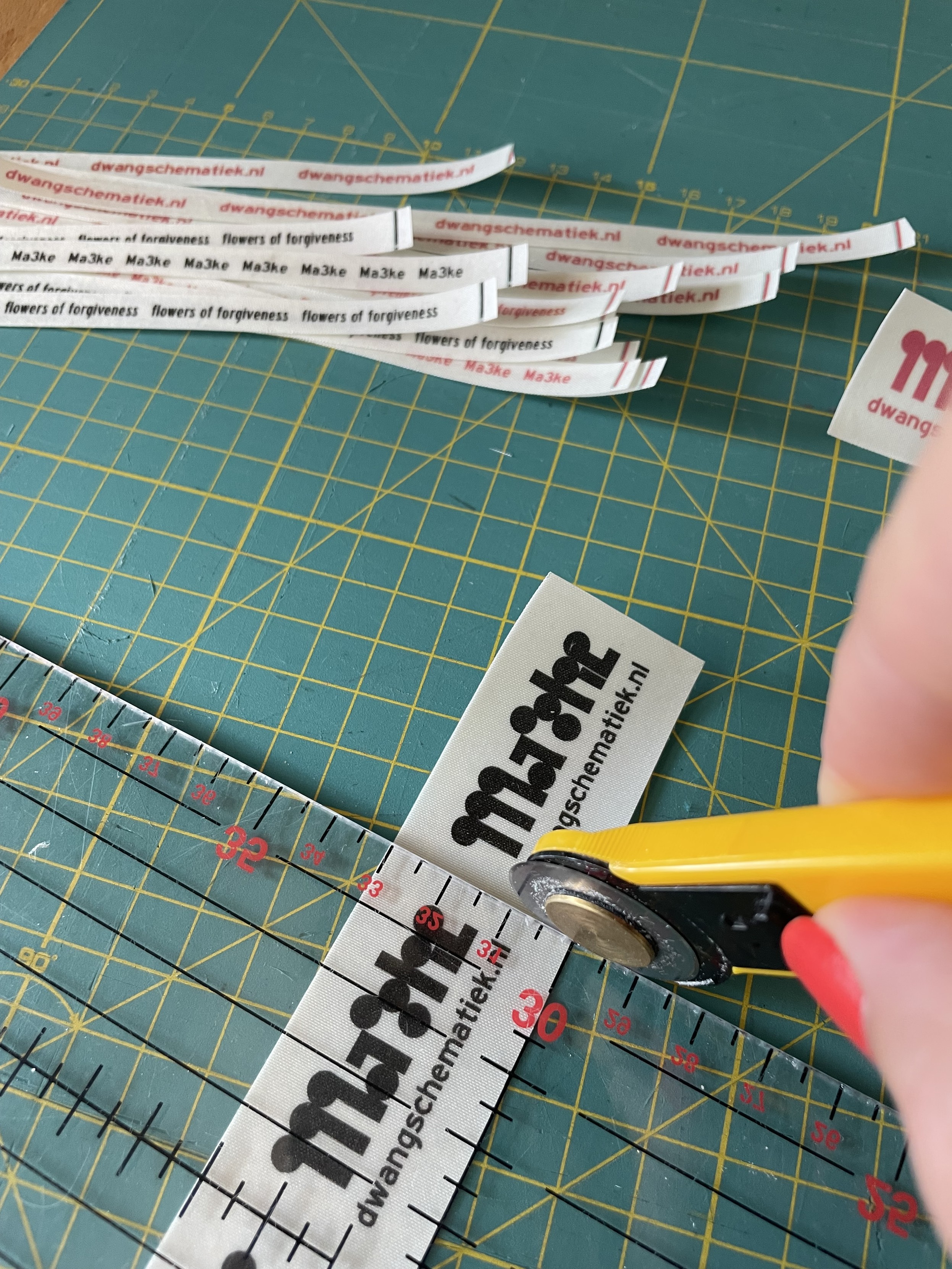 Cutting the labels from the bigger sheet. 