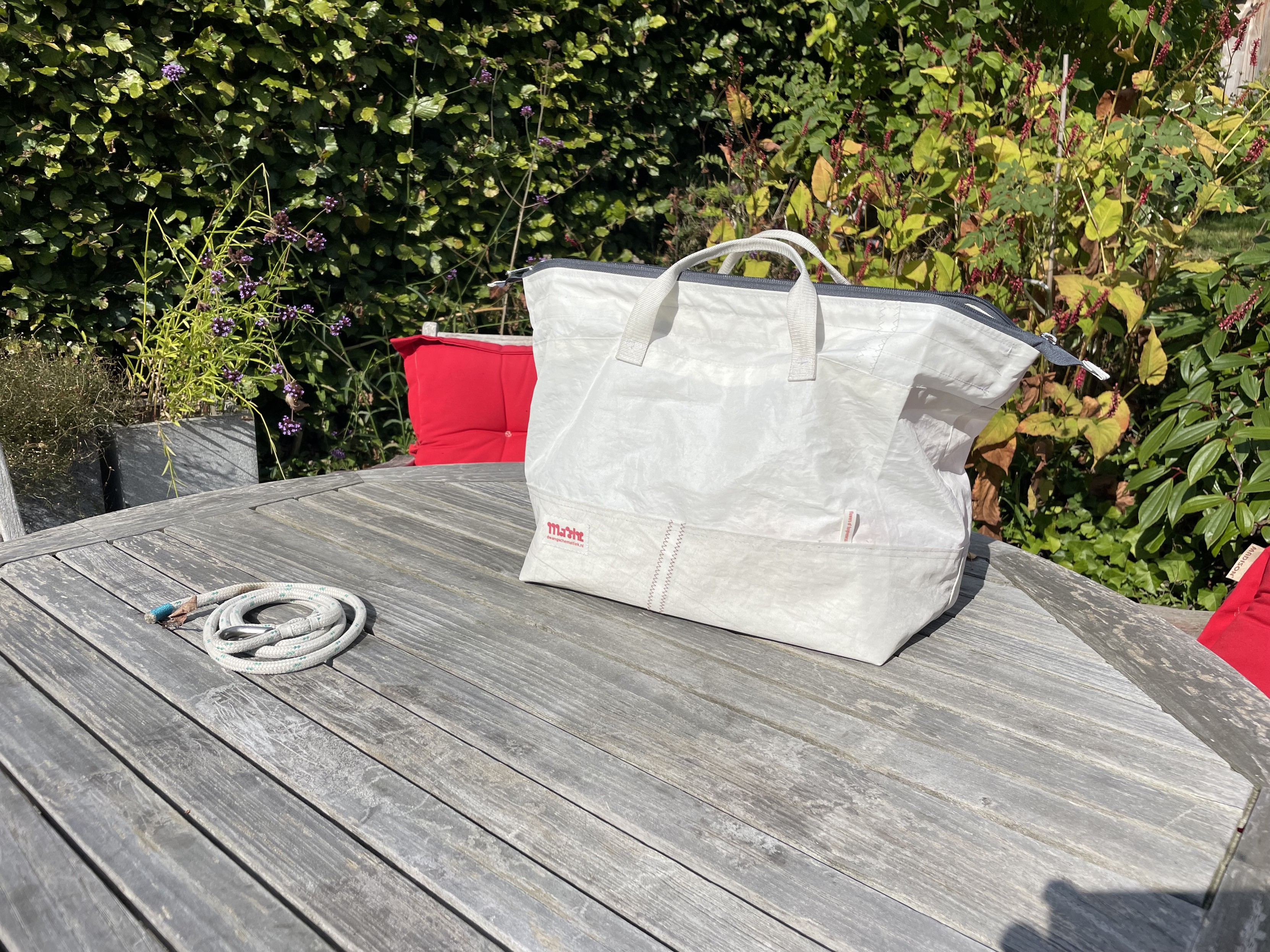 The finished bag stands on a wooden table.