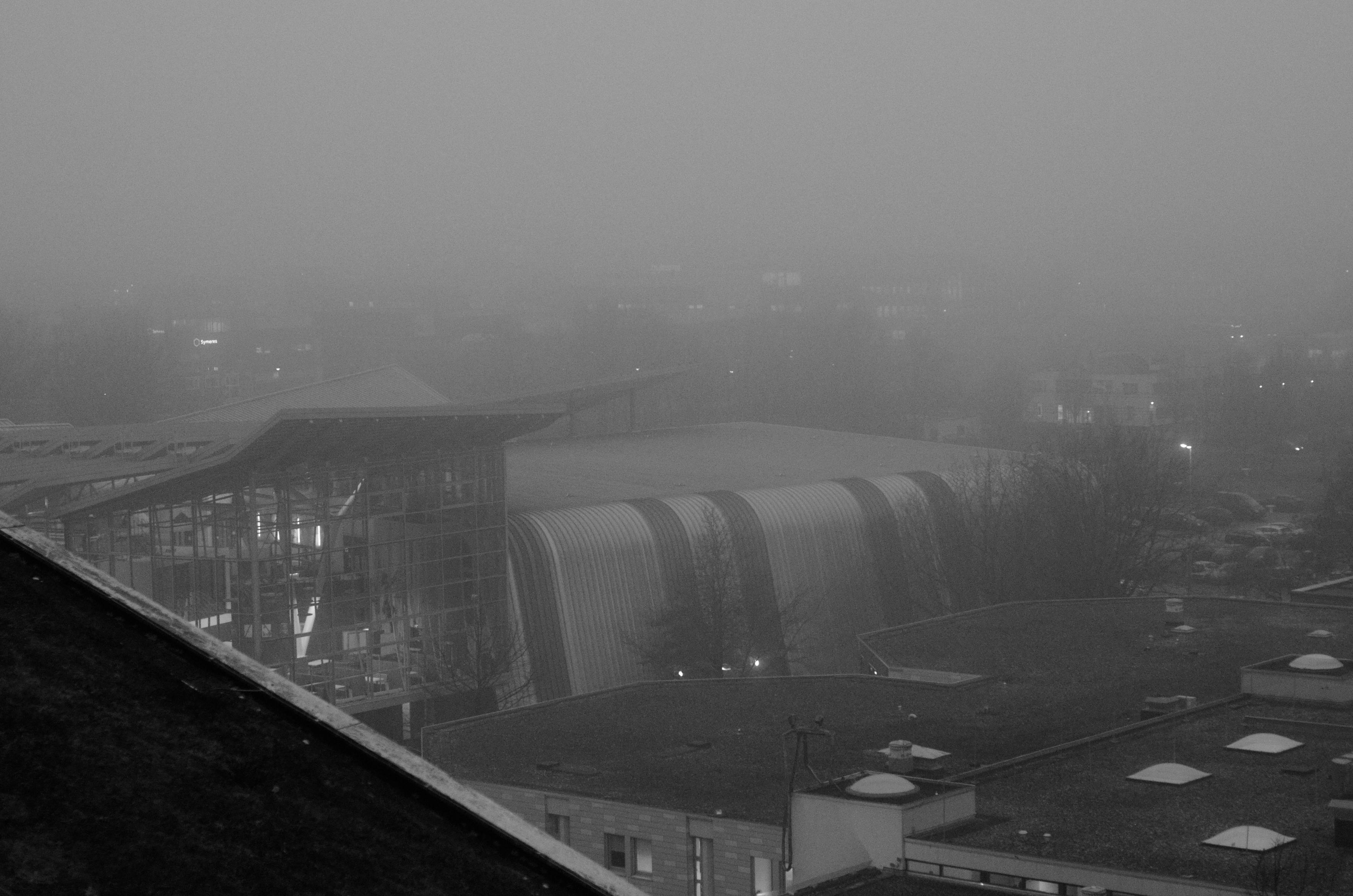 fog over the campus in noisy black and white